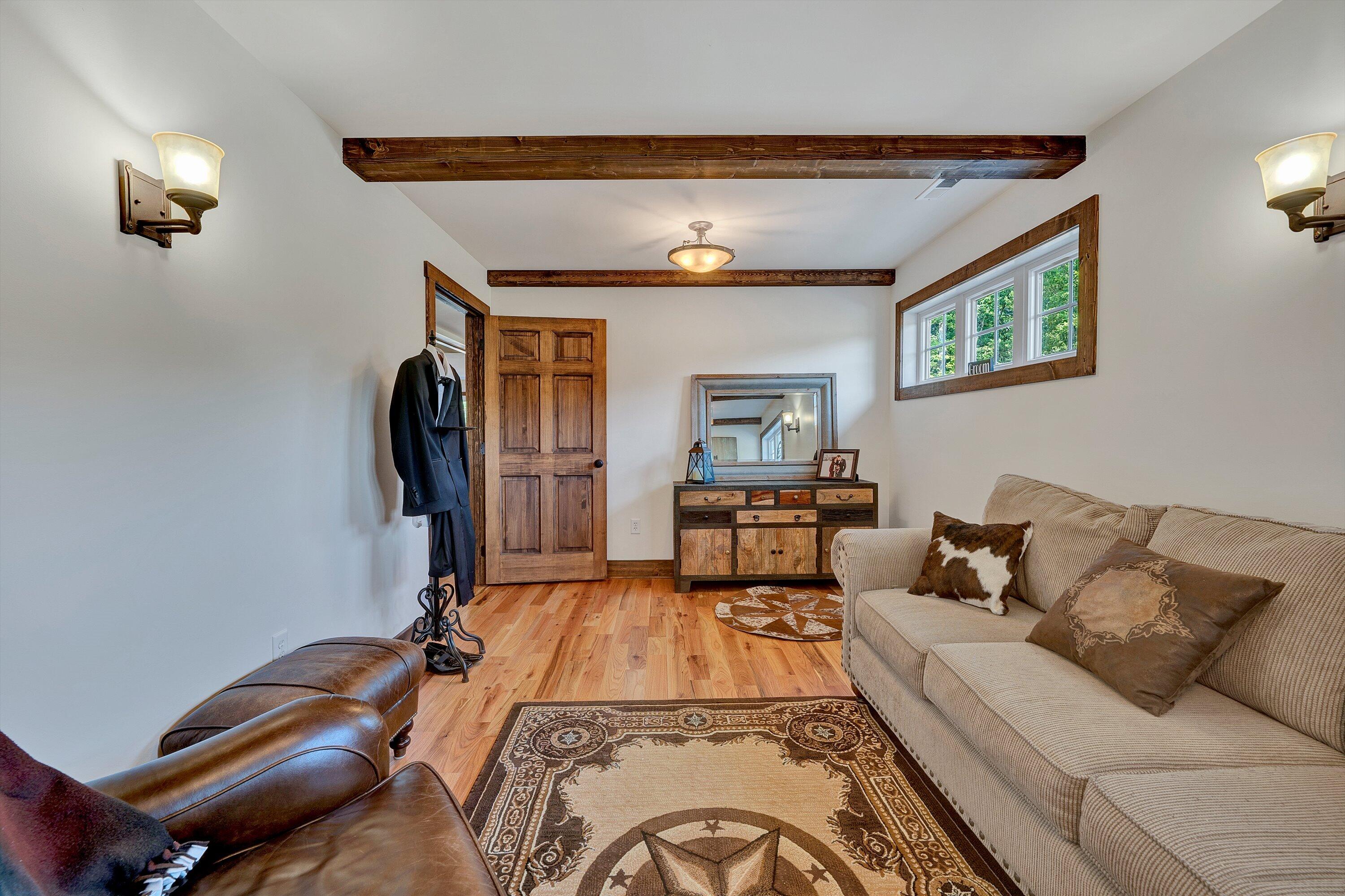 9945 Brooks Mill Road Wirtz, VA 24184 - Photo 34 of 69 a living room with furniture and a flat screen tv