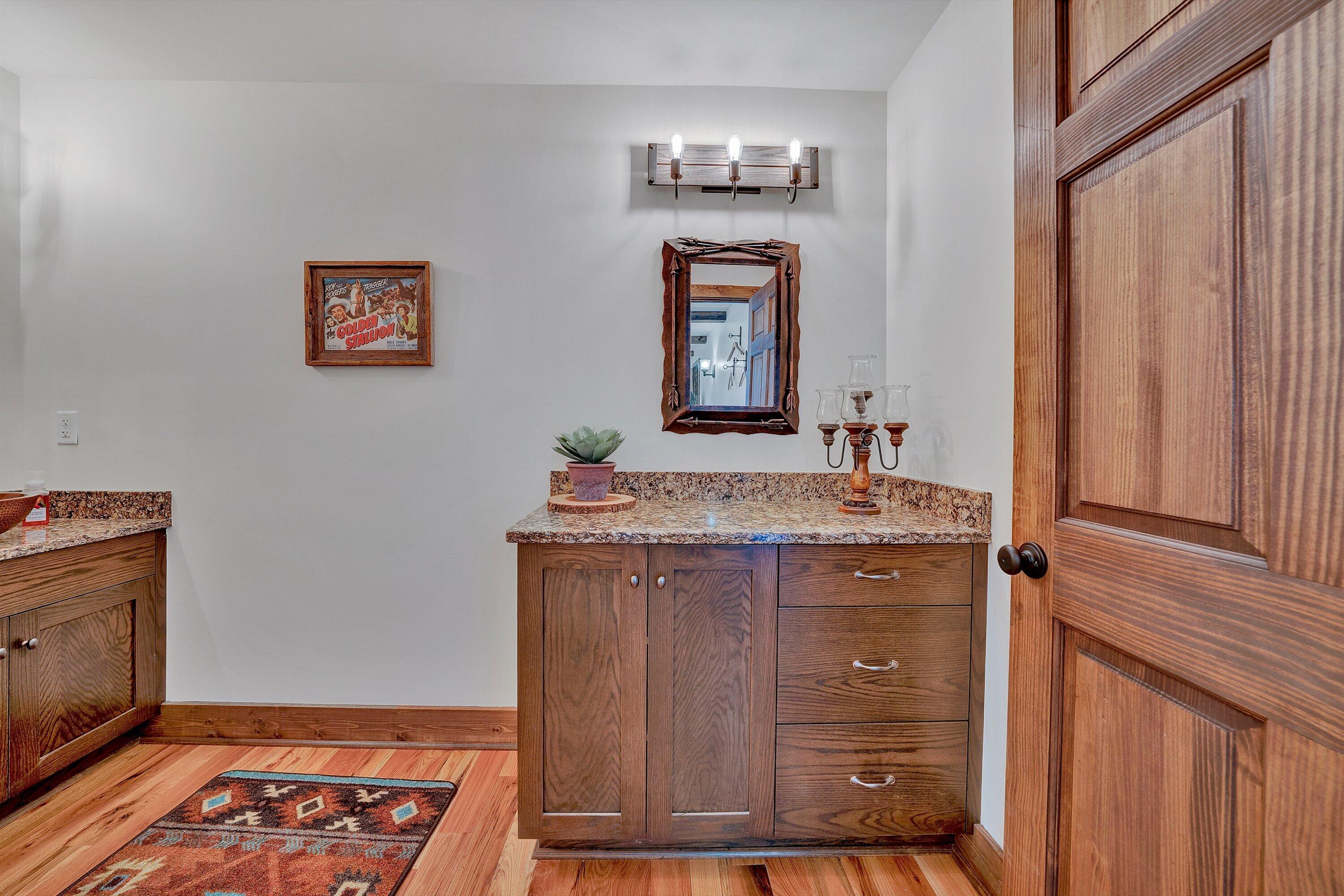 9945 Brooks Mill Road Wirtz, VA 24184 - Photo 35 of 69 a bathroom with a granite countertop sink and a mirror