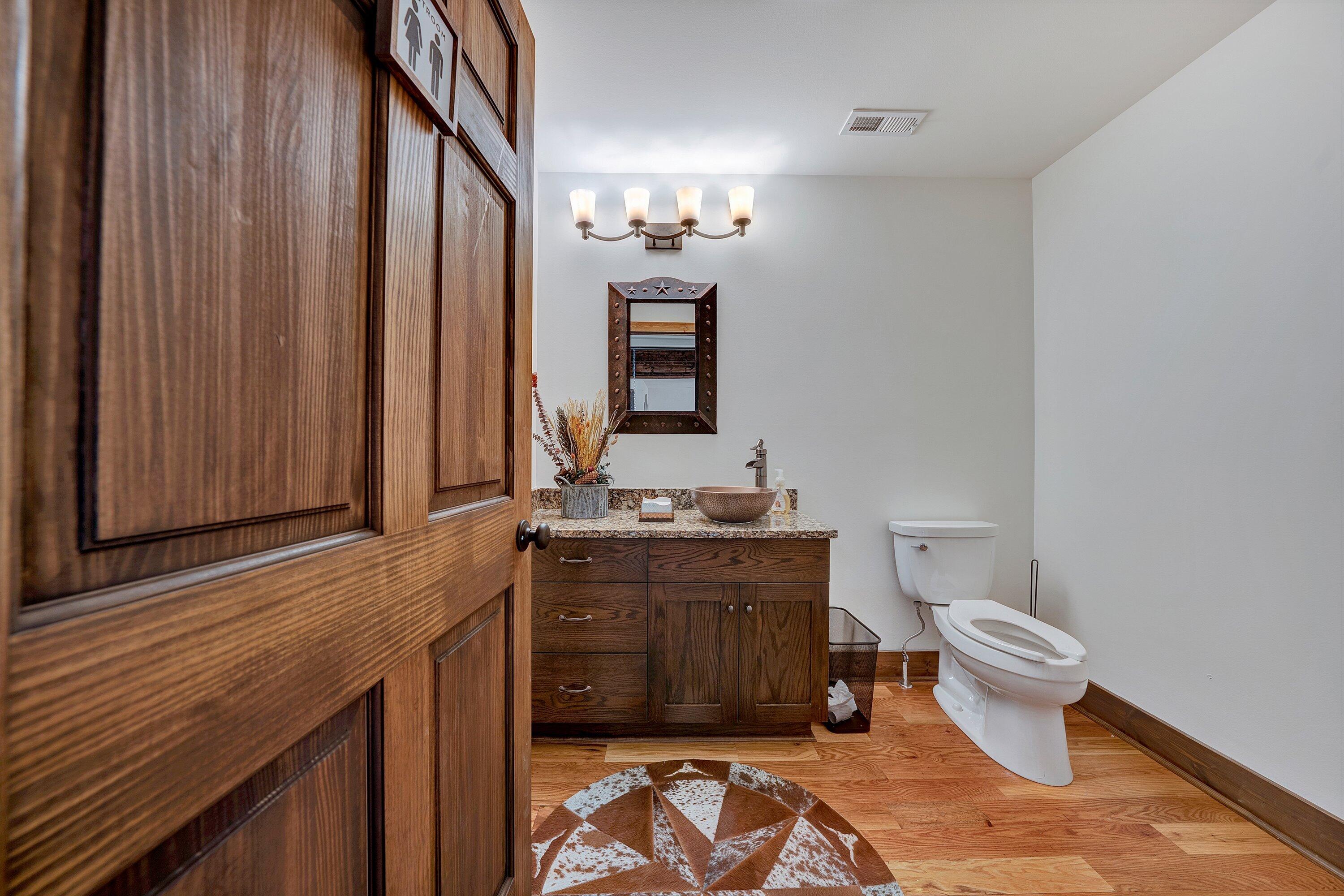 9945 Brooks Mill Road Wirtz, VA 24184 - Photo 38 of 69 a bathroom with a granite countertop toilet and a sink