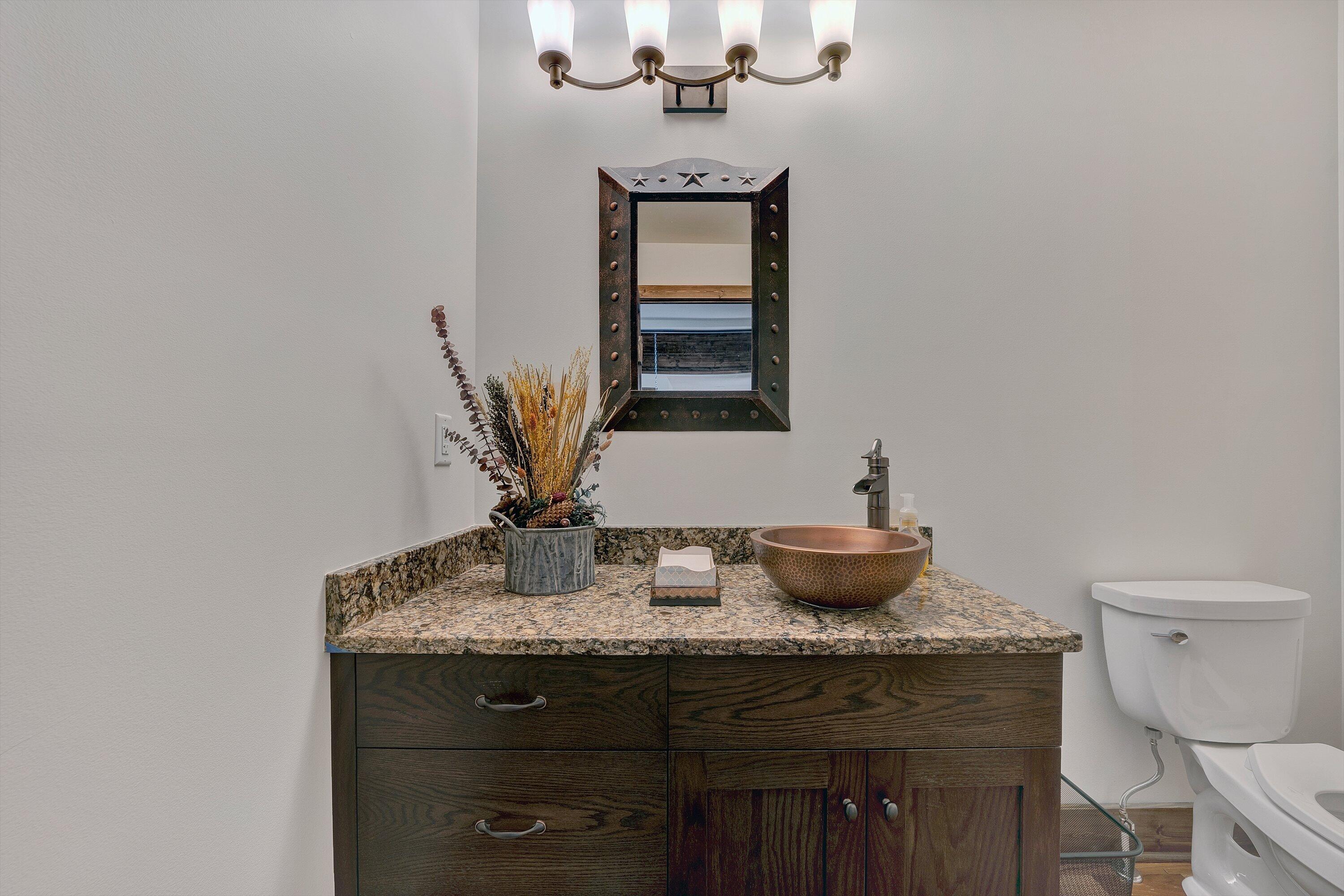9945 Brooks Mill Road Wirtz, VA 24184 - Photo 39 of 69 a bathroom with a granite countertop sink a toilet and mirror