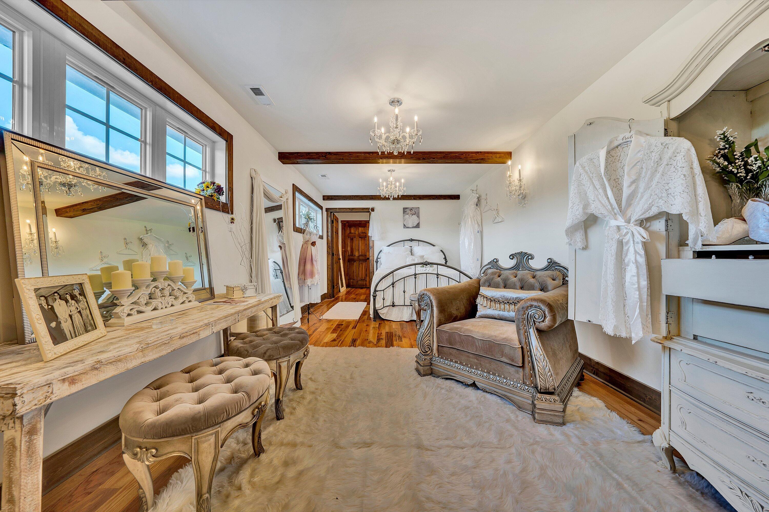 9945 Brooks Mill Road Wirtz, VA 24184 - Photo 53 of 69 a living room with furniture a rug and a chandelier
