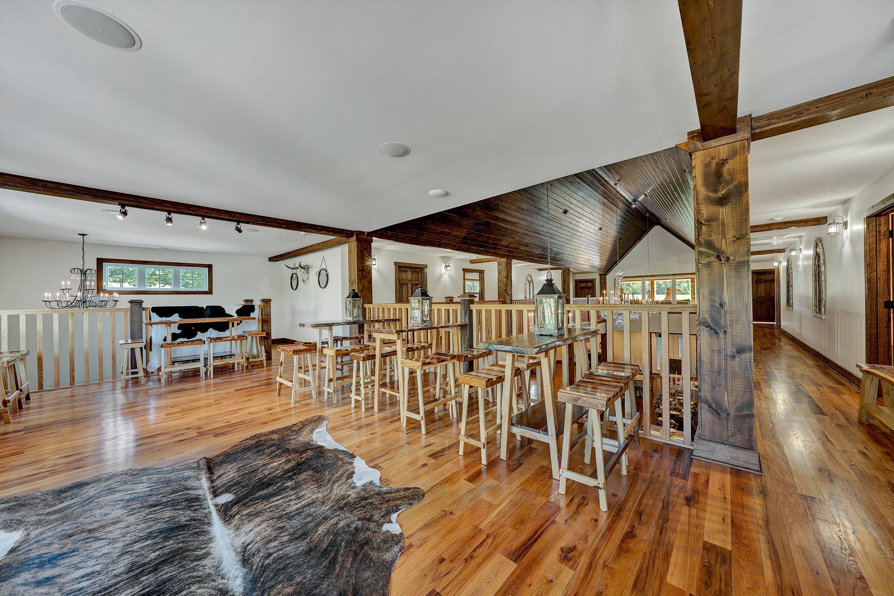 9945 Brooks Mill Road Wirtz, VA 24184 - Photo 58 of 69 a living room with lots of furniture and wooden floor