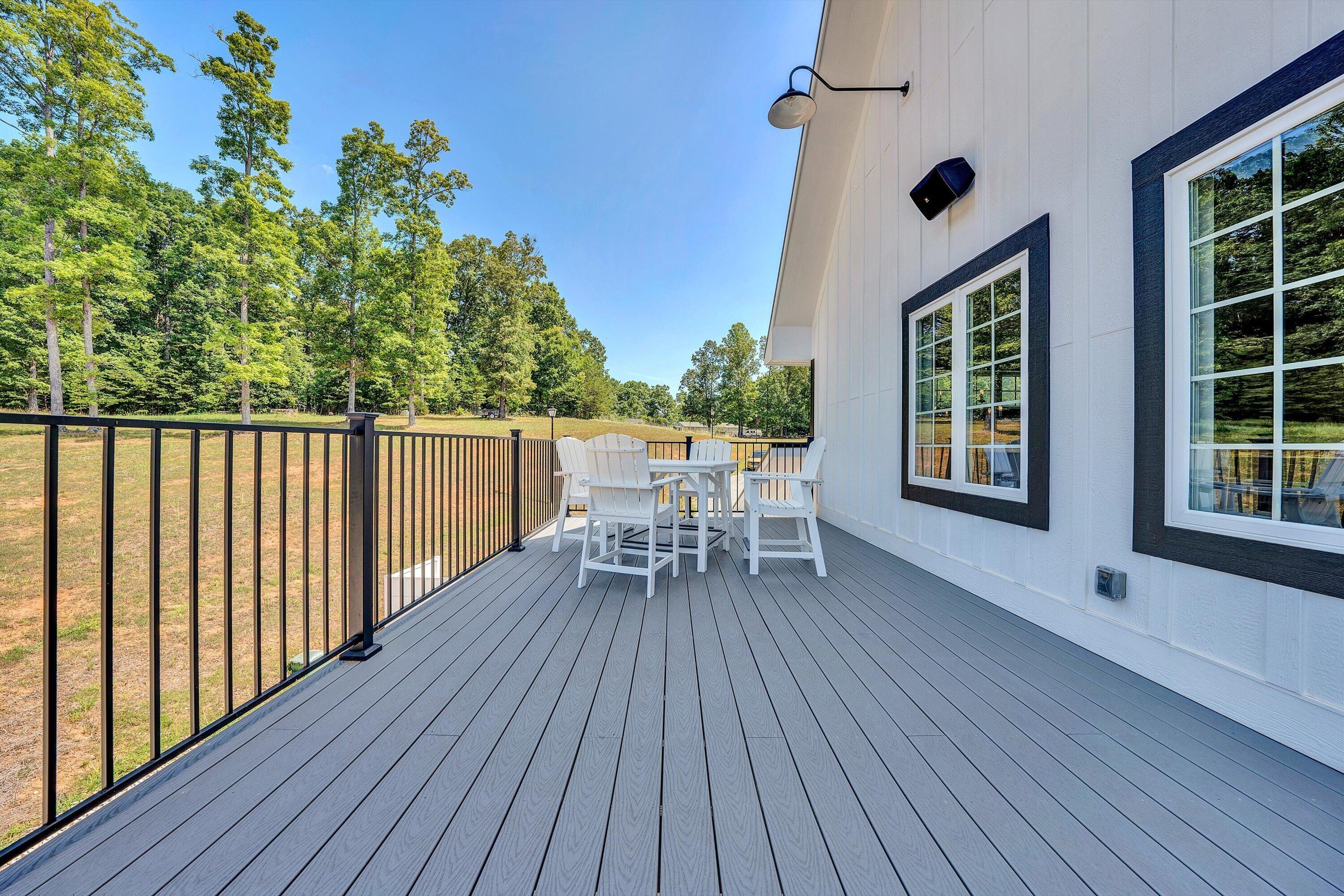 9945 Brooks Mill Road Wirtz, VA 24184 - Photo 63 of 69 a patio with wooden floor and outdoor seating
