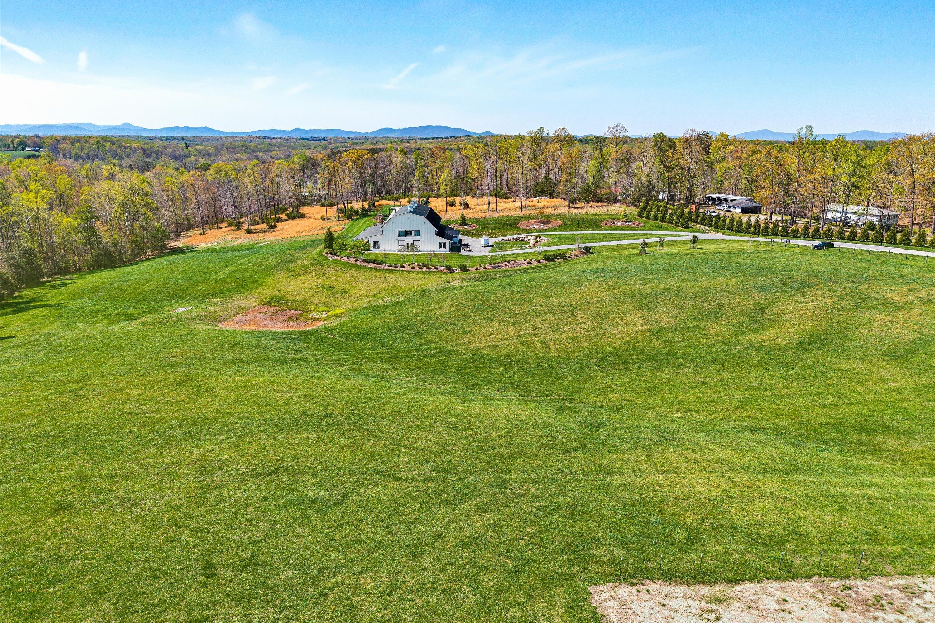 9945 Brooks Mill Road Wirtz, VA 24184 - Photo 67 of 69 a view of a lake with a yard