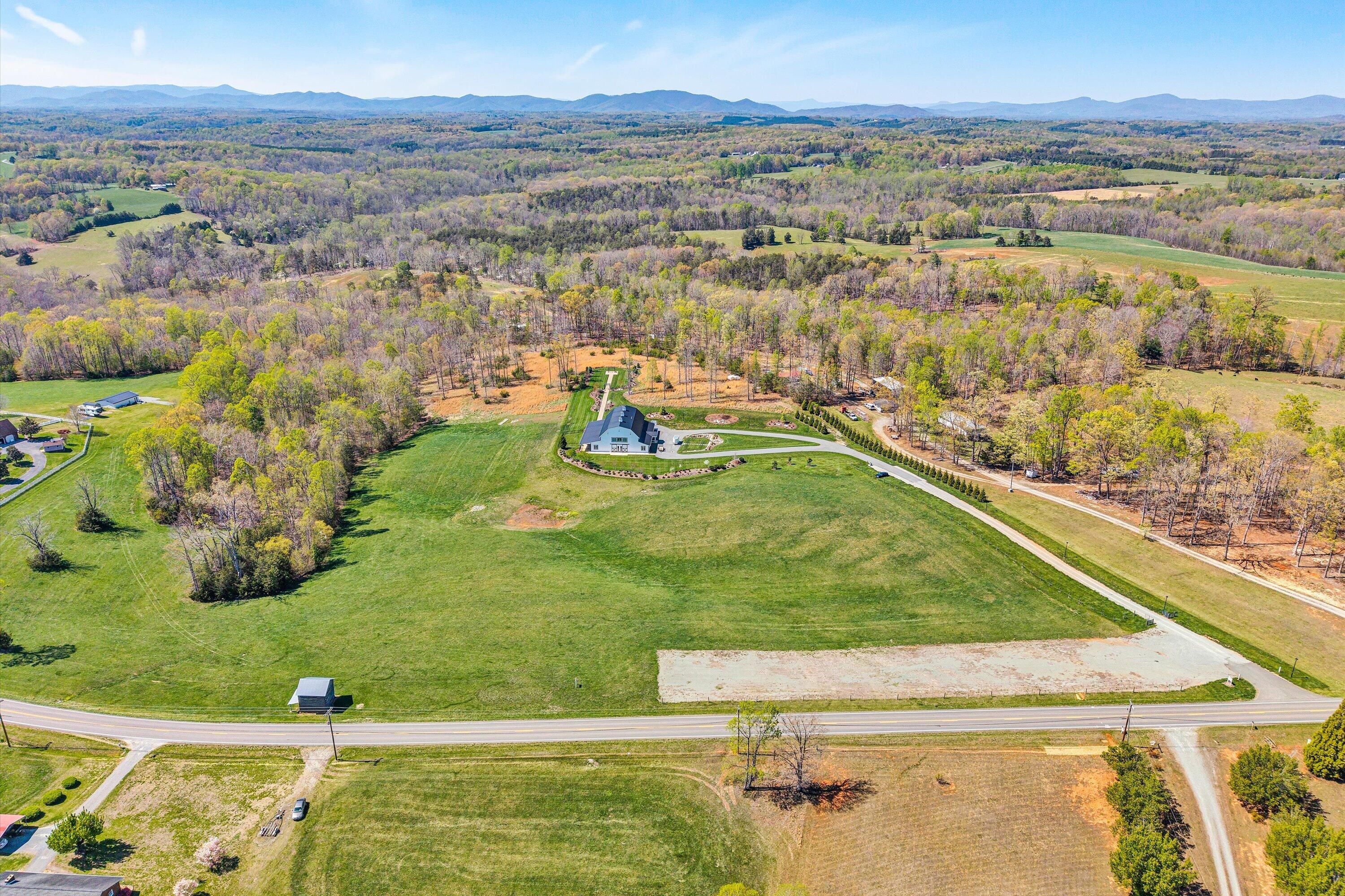 9945 Brooks Mill Road Wirtz, VA 24184 - Photo 69 of 69 a view of a lake with a mountain