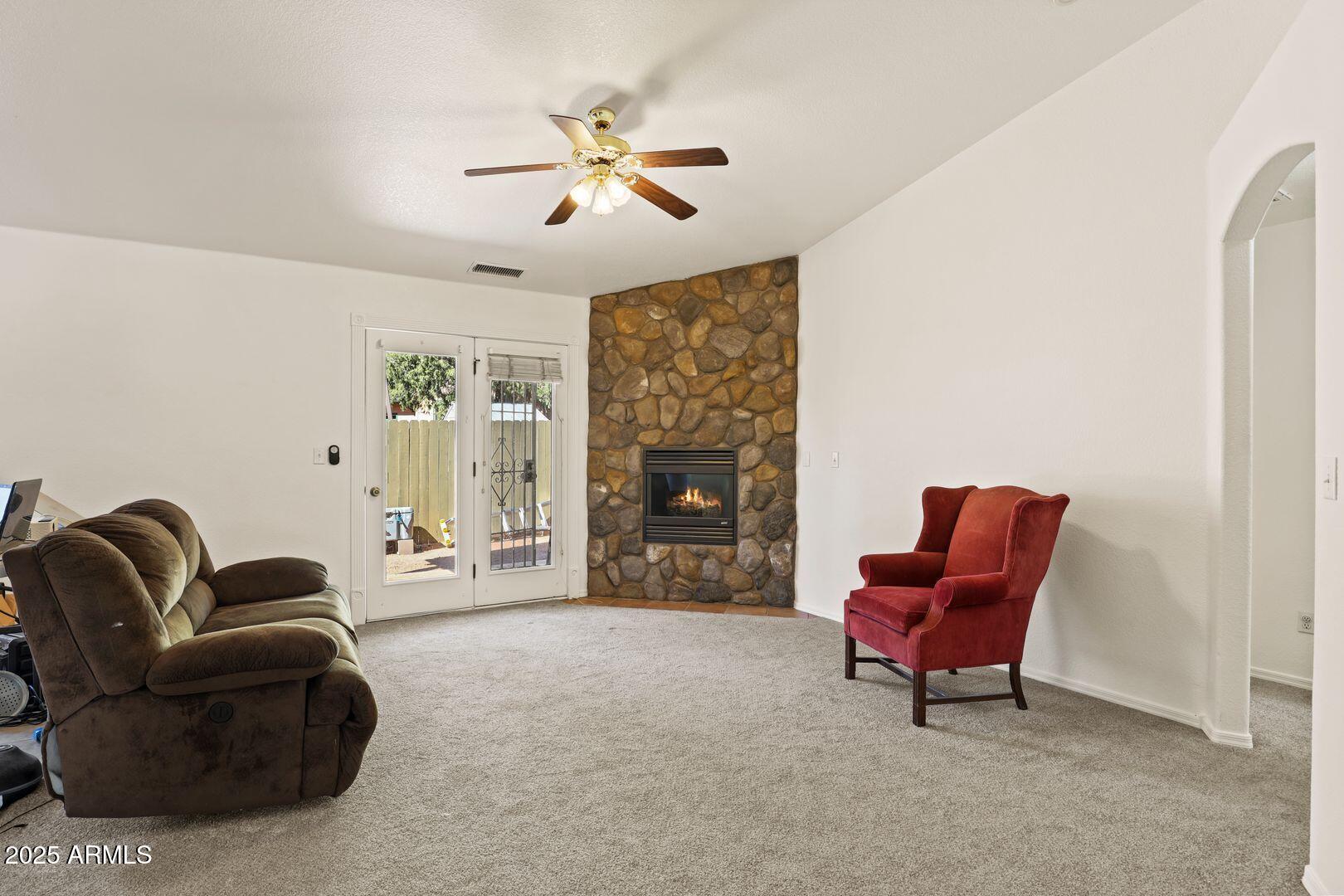 510 North Oak Ridge Road Payson, AZ 85541 - Photo 10 of 36 a living room with furniture and a fireplace