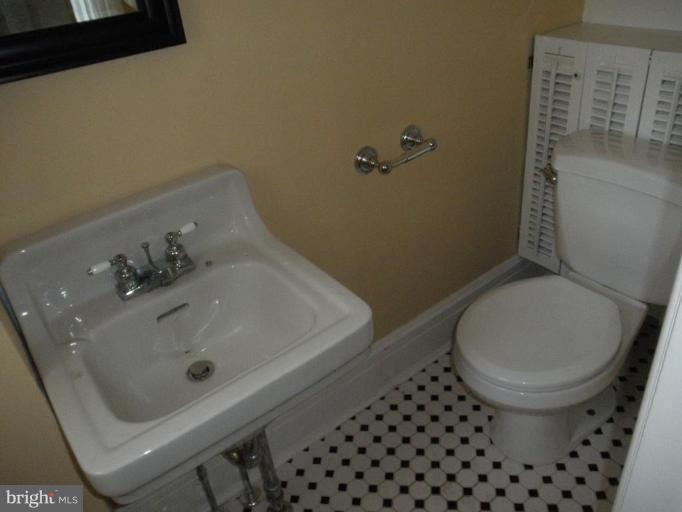 5305 Falls Rd Terrace Baltimore, MD 21210 - Photo 13 of 20 a bathroom with a sink and a toilet