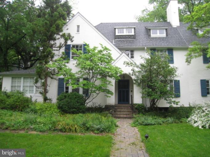 5305 Falls Rd Terrace Baltimore, MD 21210 - Photo 15 of 20 a front view of a house with a yard and trees