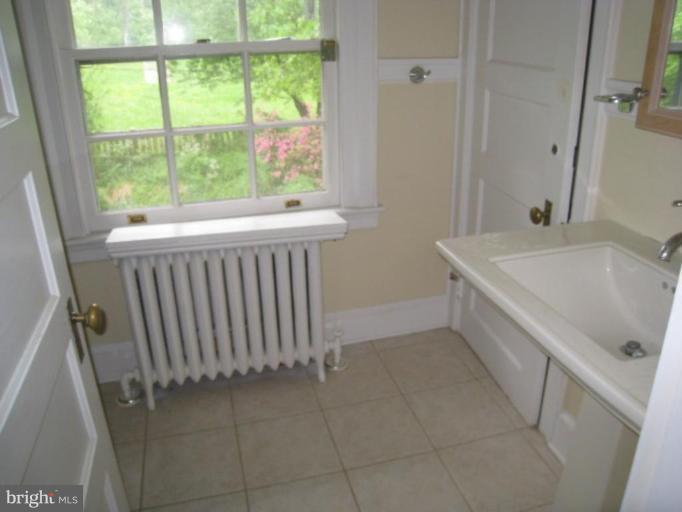 5305 Falls Rd Terrace Baltimore, MD 21210 - Photo 9 of 20 a bathroom with a sink and a tub