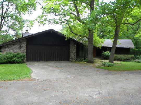 a house with trees in the background