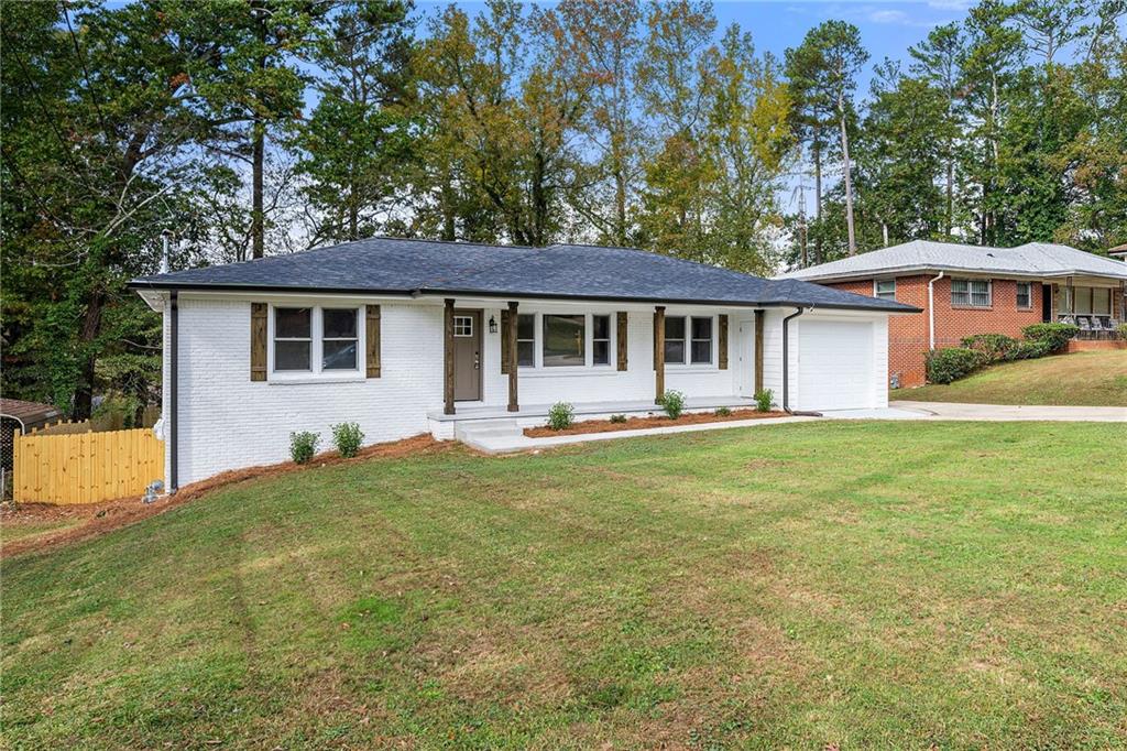 2373 Glendale Drive Decatur, GA 30032 - Photo 1 of 1 a front view of a house with yard patio and green space