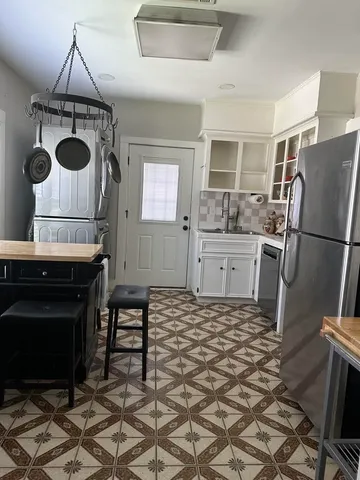 a kitchen with a sink a stove and refrigerator