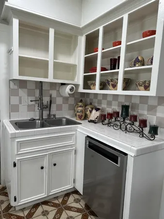 a kitchen with a sink and cabinets