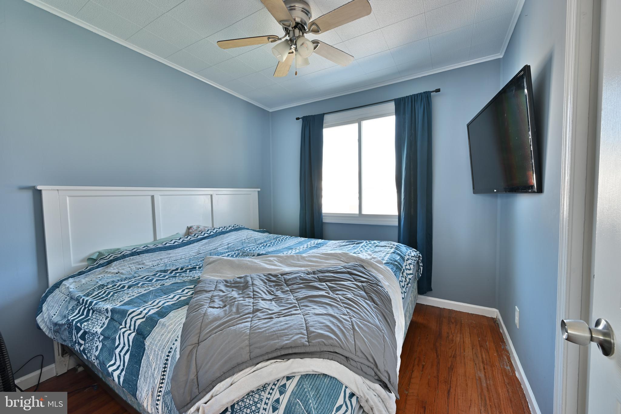 323 Mill Road Burlington, NJ 08016 - Photo 11 of 15 a bedroom with a bed and a flat tv screen