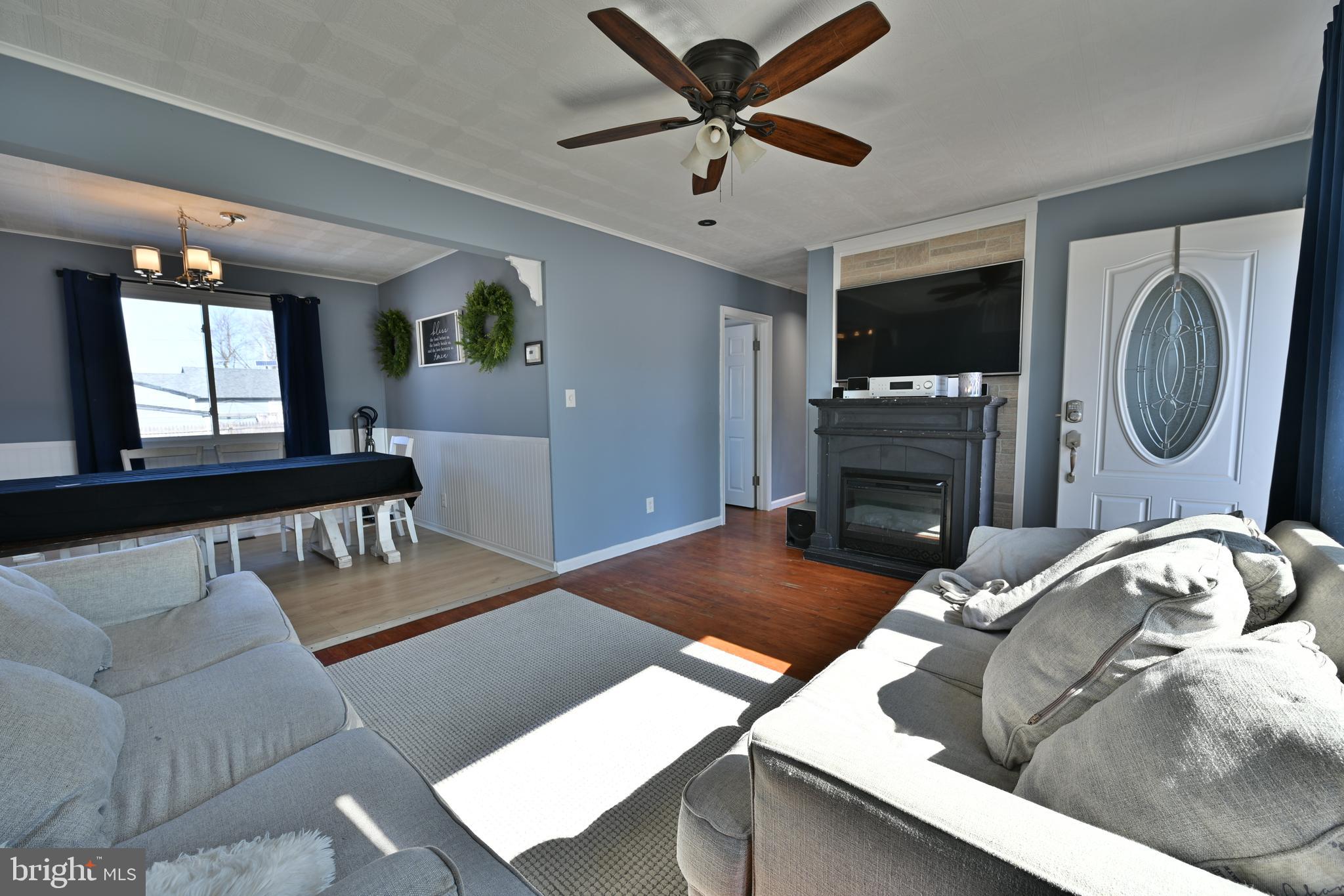 323 Mill Road Burlington, NJ 08016 - Photo 3 of 15 a living room with furniture and a wooden floor