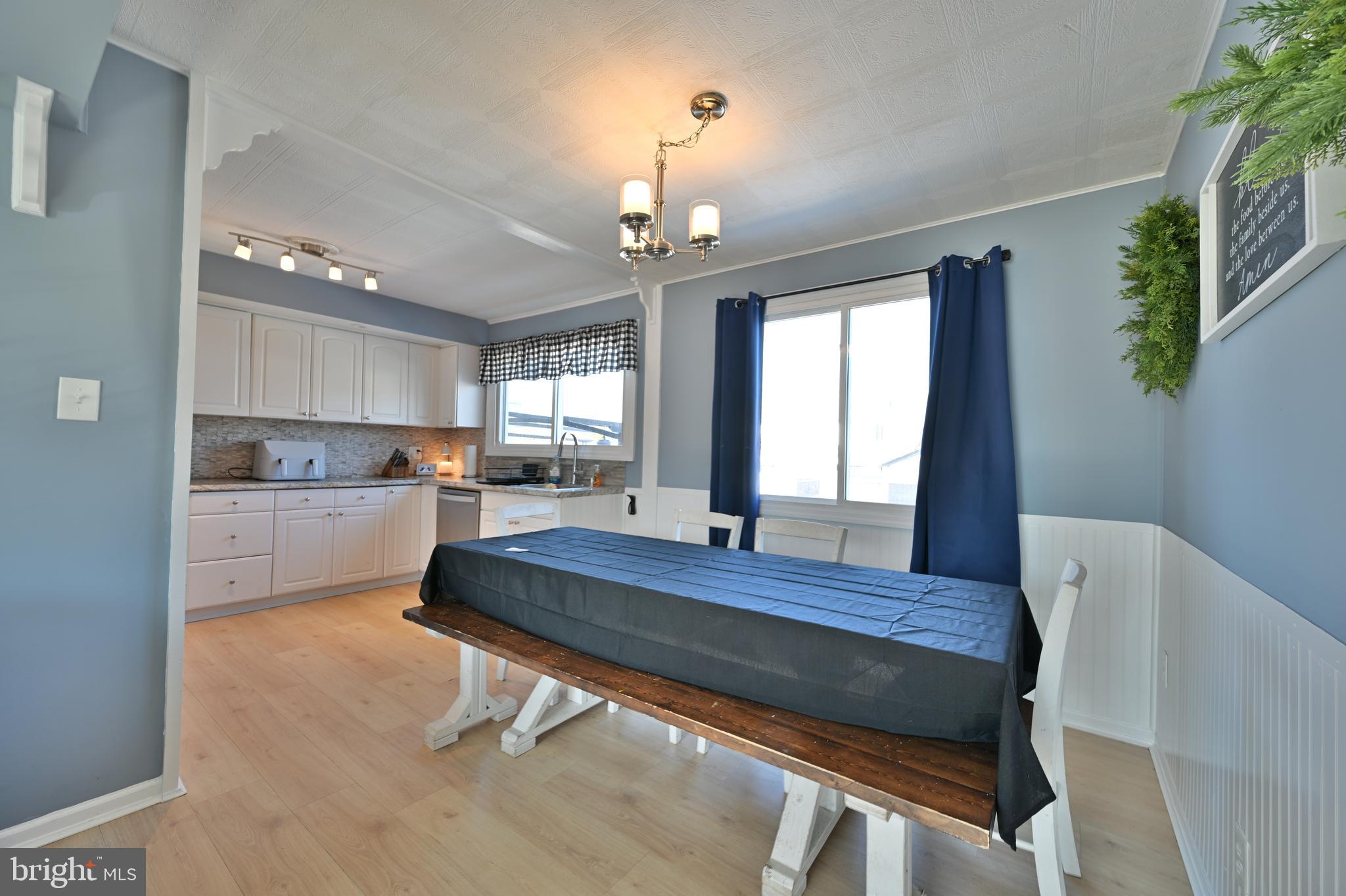 323 Mill Road Burlington, NJ 08016 - Photo 4 of 15 a living room with a table chairs and entryway