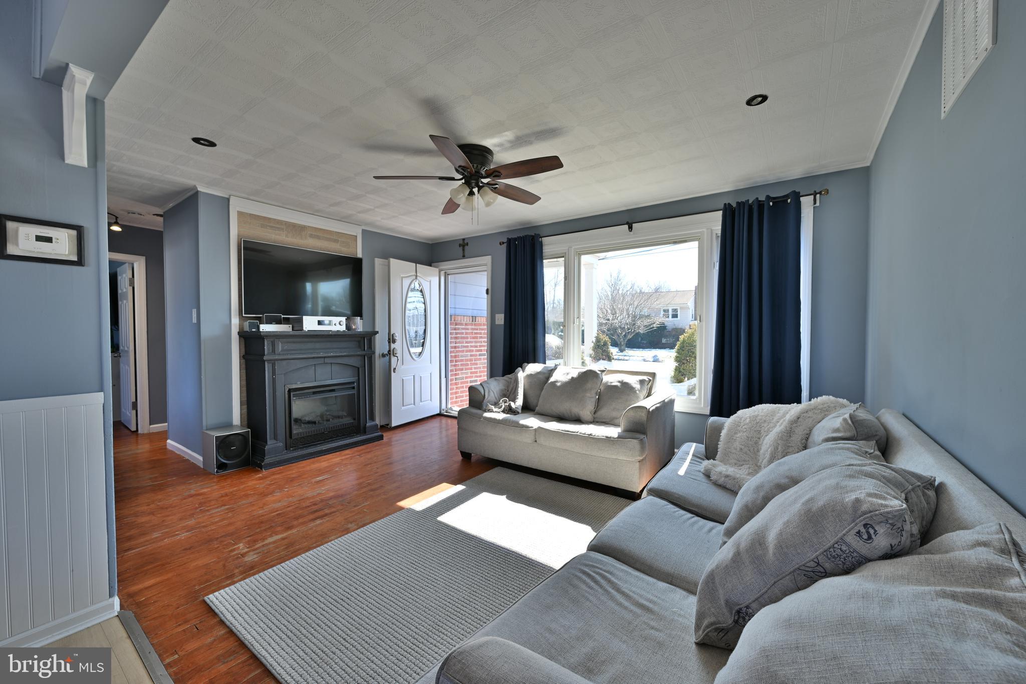 323 Mill Road Burlington, NJ 08016 - Photo 10 of 15 a living room with furniture and a large window