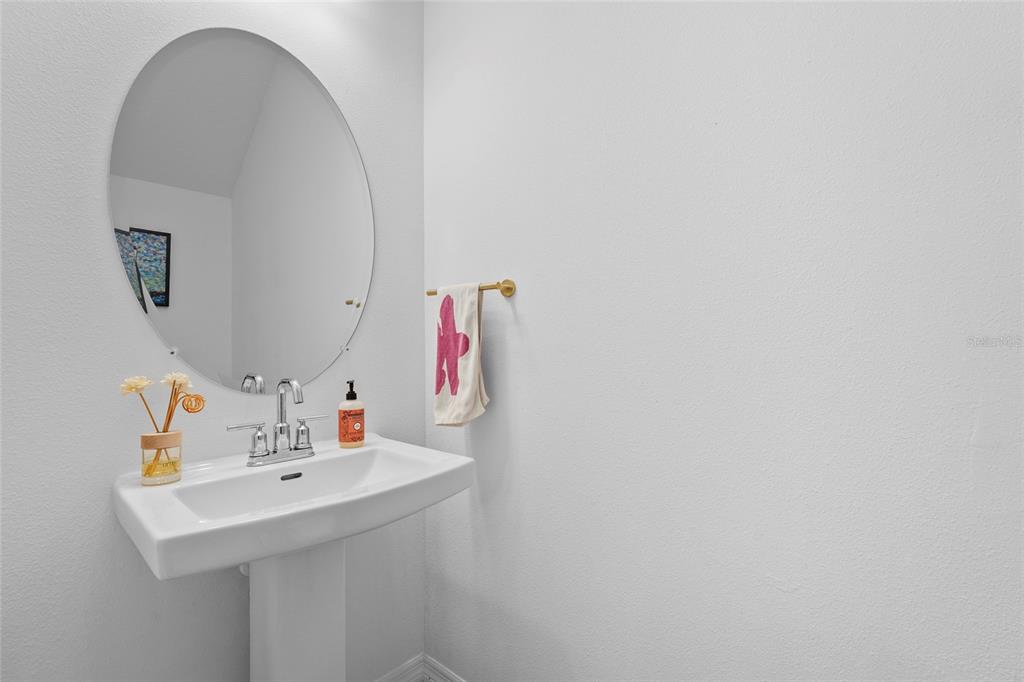 8564 Lunar Skye Street Sarasota, FL 34241 - Photo 15 of 44 a bathroom with a sink and a mirror
