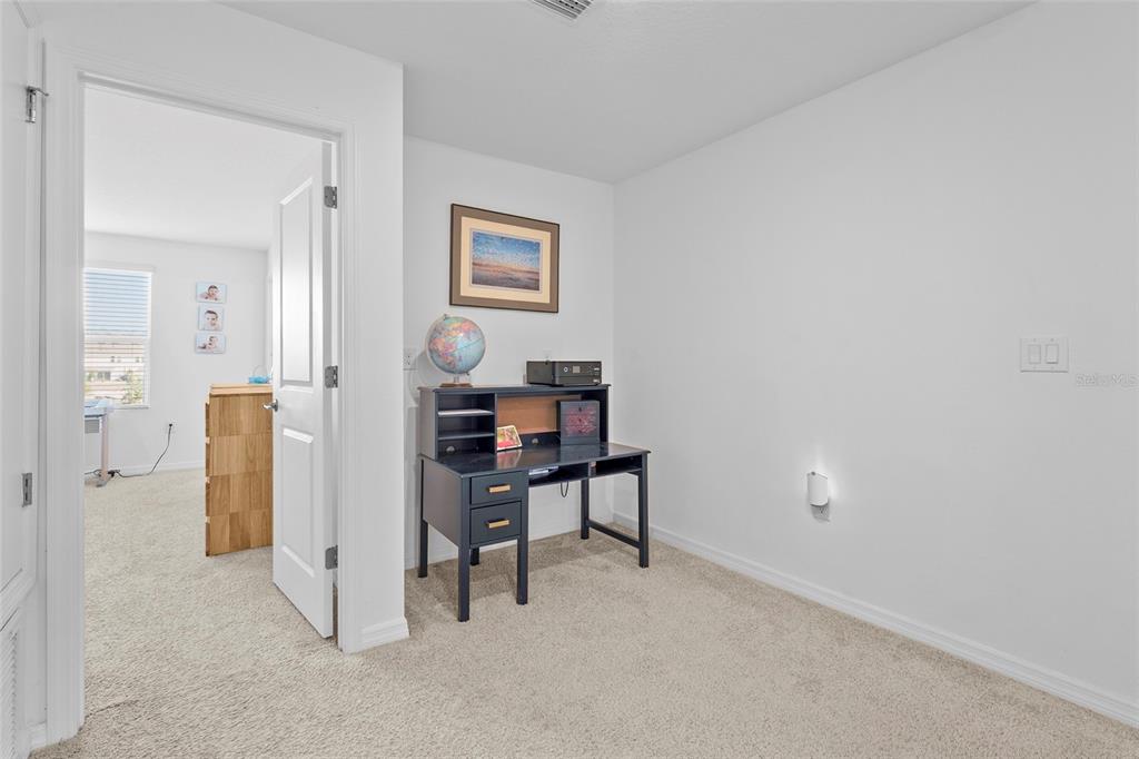 8564 Lunar Skye Street Sarasota, FL 34241 - Photo 16 of 44 a view of a workspace with closet