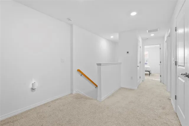 an empty room with white walls and white walls