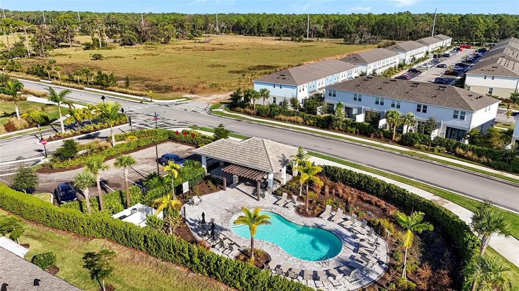 8564 Lunar Skye Street Sarasota, FL 34241 - Photo 33 of 44 an aerial view of lake and residential houses with outdoor space