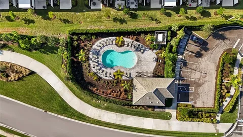 a view of swimming pool with chairs