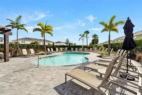 a view of a swimming pool with a patio