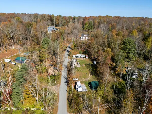 a view of a backyard with a car parked in it