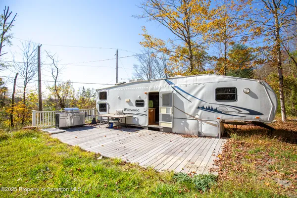a kitchen with stainless steel appliances granite countertop a stove a refrigerator and a microwave