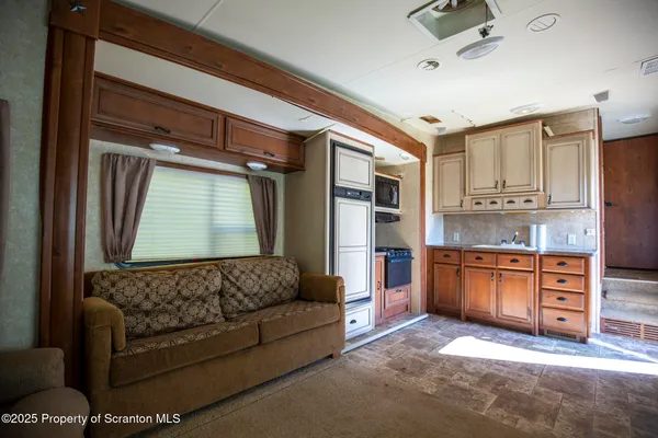 a bathroom with a sink a mirror and cabinets