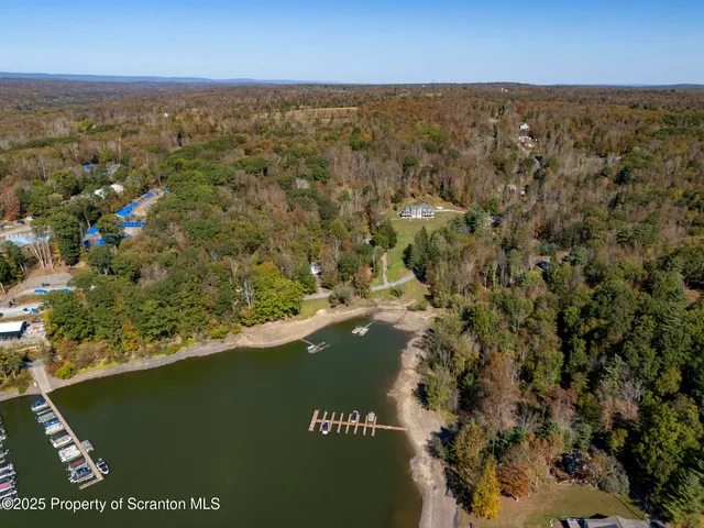 an aerial view of valley and lake