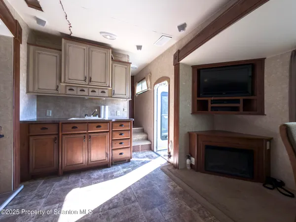 a kitchen with a sink stove and refrigerator