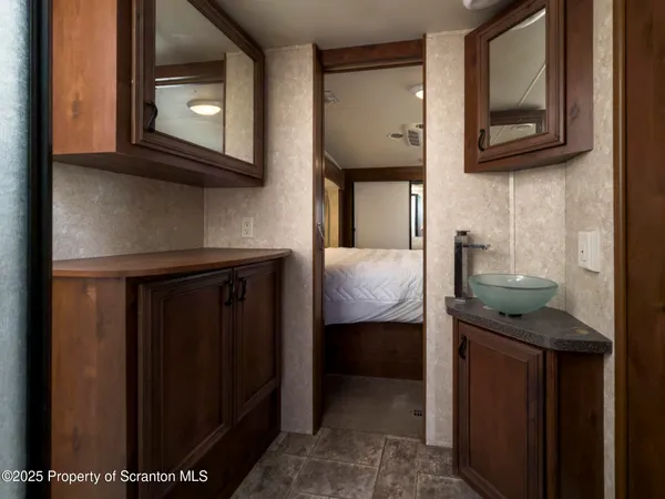 a dining room with furniture and a flat screen tv