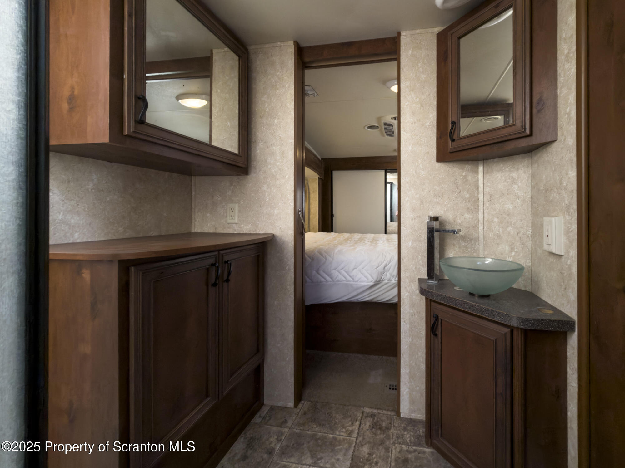 0 Lacawac Road Lake Ariel, PA 18436 - Photo 25 of 66 a bathroom with a sink a mirror and cabinets