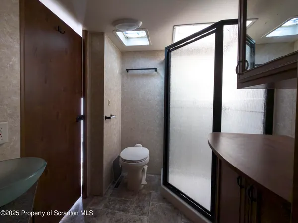 a view of a kitchen area with furniture and a window