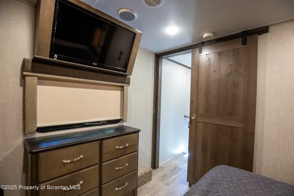 a kitchen with stainless steel appliances granite countertop a stove and a microwave