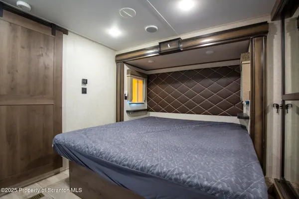 a kitchen that has a lot of cabinets in it