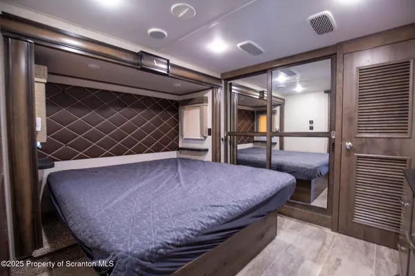 a living room with a couch and a fireplace