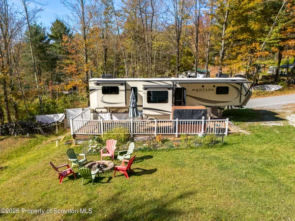a view of a backyard with sitting area