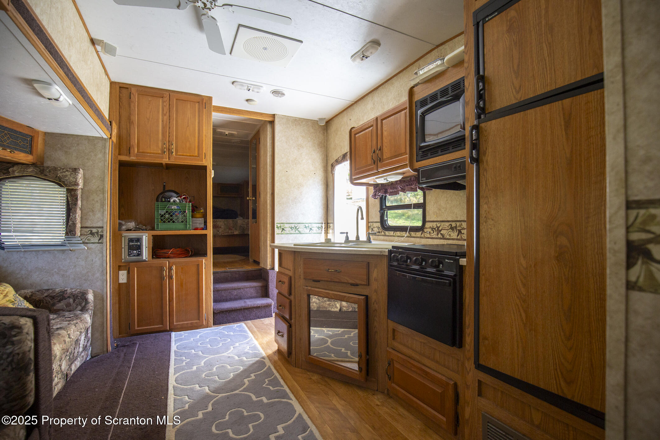0 Lacawac Road Lake Ariel, PA 18436 - Photo 58 of 66 a kitchen with stainless steel appliances granite countertop a refrigerator and a stove top oven
