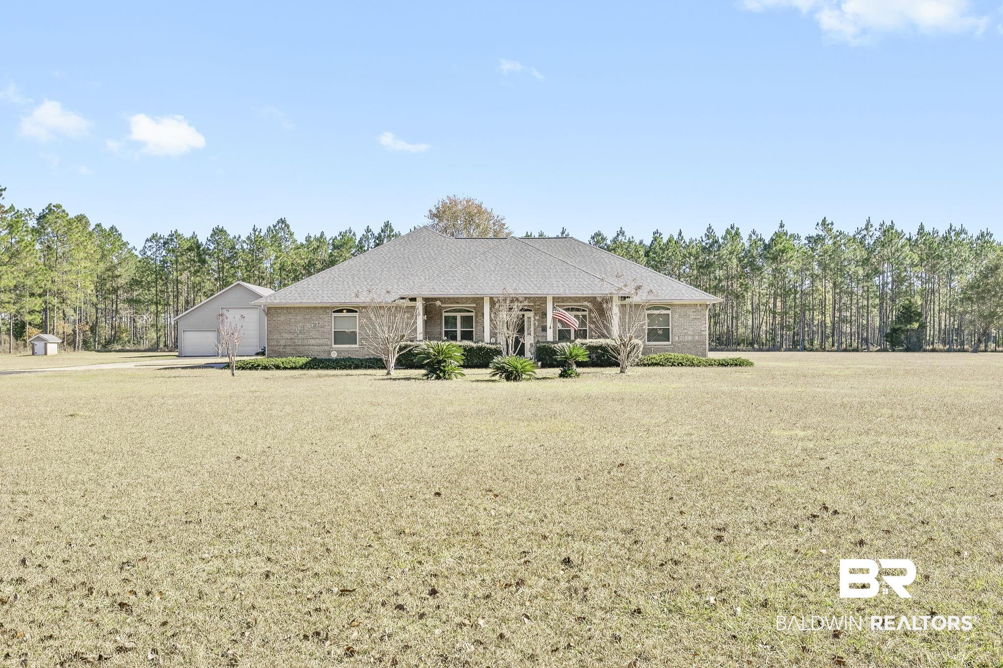 24130 Cowling Road Robertsdale, AL 36567 - Photo 2 of 71 Ranch-style home with a garage and a front yard
