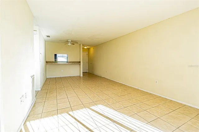 a view of a room with wooden floor and a sink
