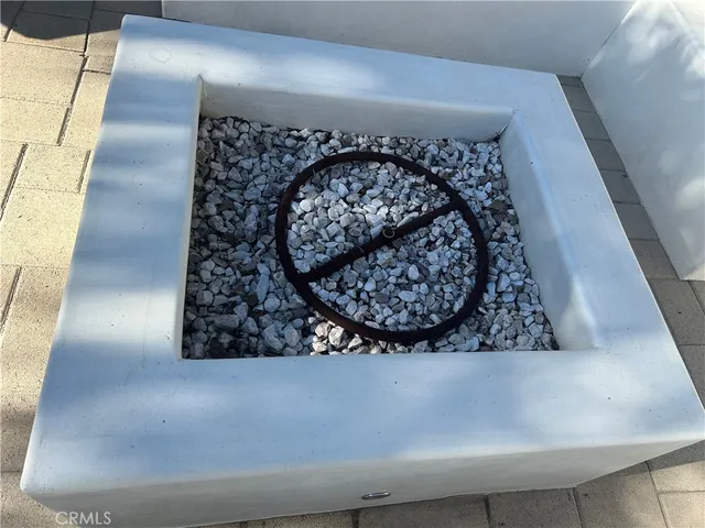 a view of a patio with table and chairs with wooden floor and fence
