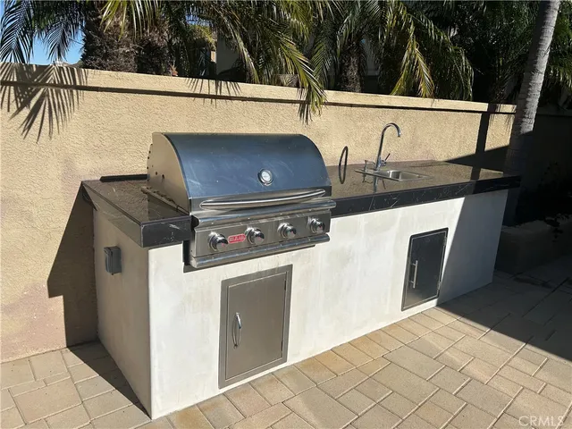 a view of a backyard with sitting area