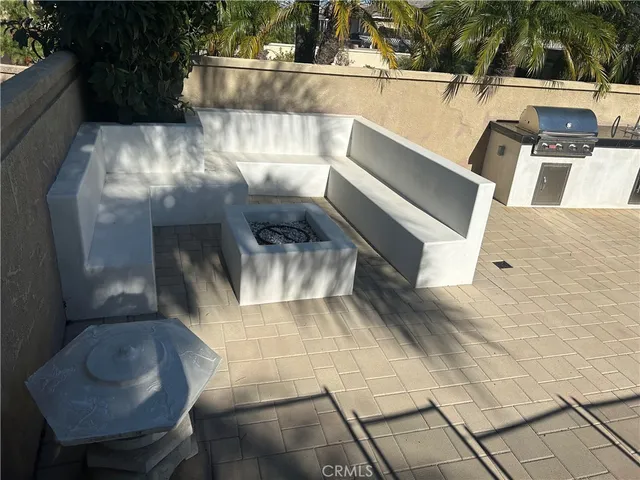 a view of a backyard with sitting area