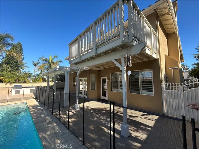 a large kitchen with granite countertop a sink and dishwasher a stove top oven with wooden floor