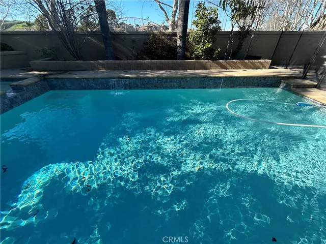 a kitchen with a sink and wooden cabinets