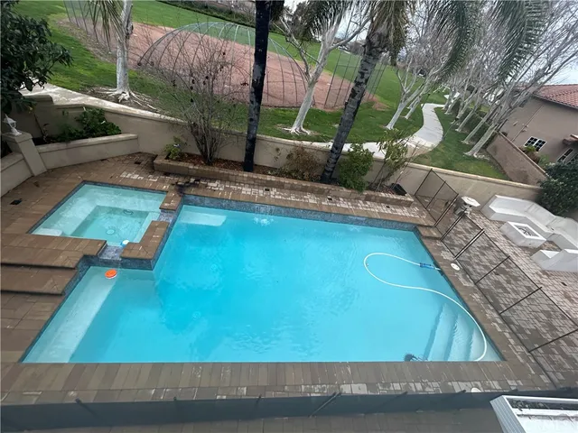 a large kitchen with kitchen island granite countertop a sink and a stove