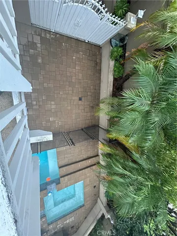 a kitchen with granite countertop wooden cabinets and stainless steel appliances