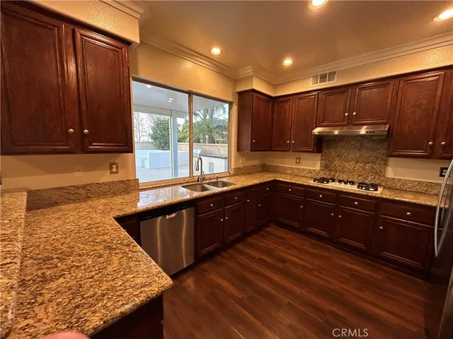 a view of entryway with wooden floor and stairs